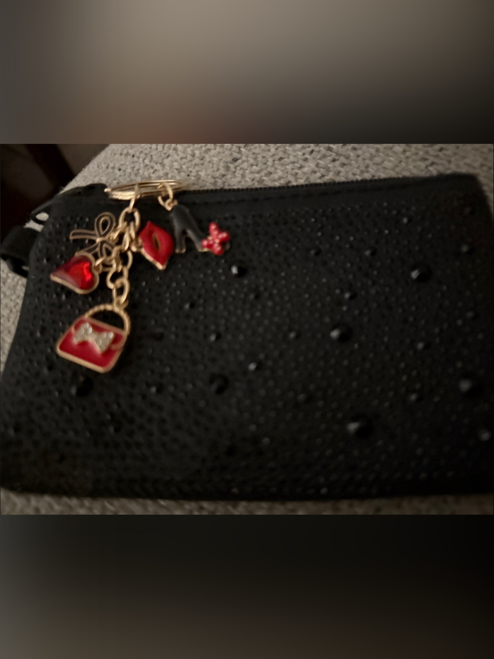 Black Textured Rhinestone Wallet Madden paired with bag charm.